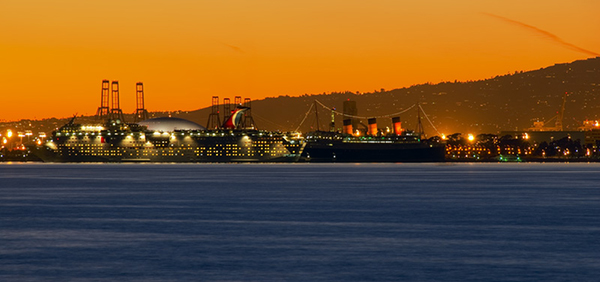 Photo of Downtown Long Beach with the Queen Mary at sunset.
