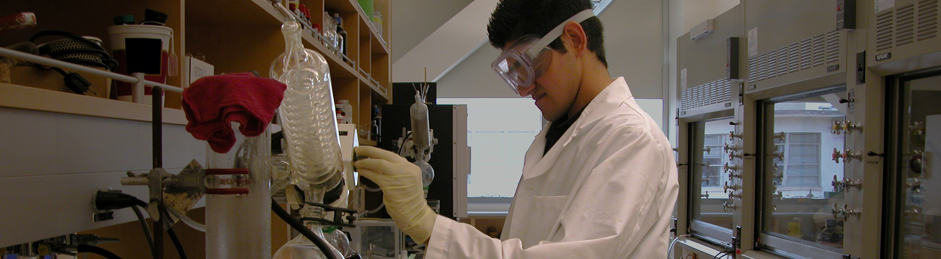 research student adjusting settings on lab equipment