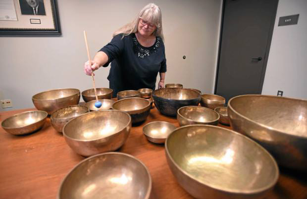 Carolyn playing just some of her singing bowl collection at the BCCM.