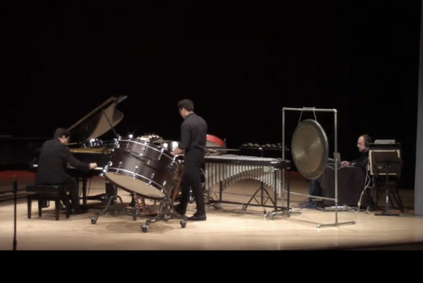 A live performance of a piece for piano, percussion, and electronics.