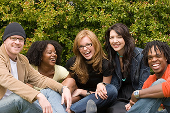 A group of five students laughing and having fun.
