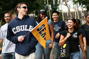 CSULB students walking across campus with school spirit.
