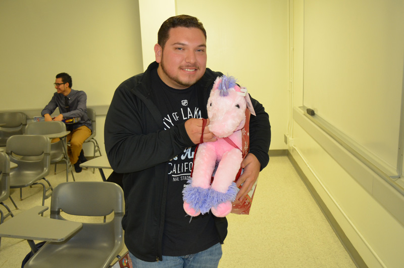student holding plush doll