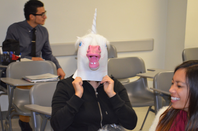 student wearing horse mask