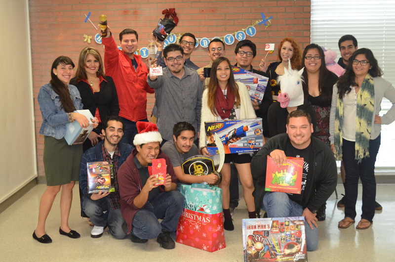students posing with gifts