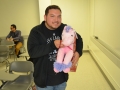 student holding plush doll