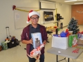 student posing with gift